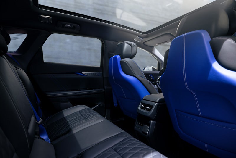Back Seat View of the 2026 OPTIQ-V Blue Front Seats, Sun Roof, and Interior | Allen Cadillac in Monroe MI